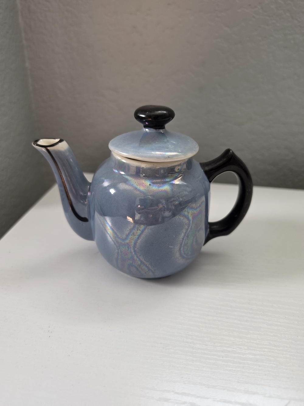 Antique Iridescent Blue Ceramic Teapot with Black Handle and Knob